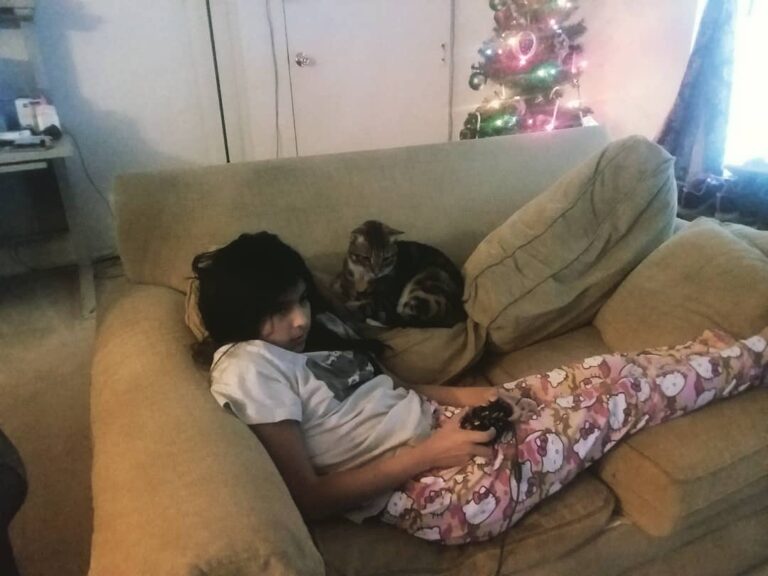 Keeping his hooman sister some company.