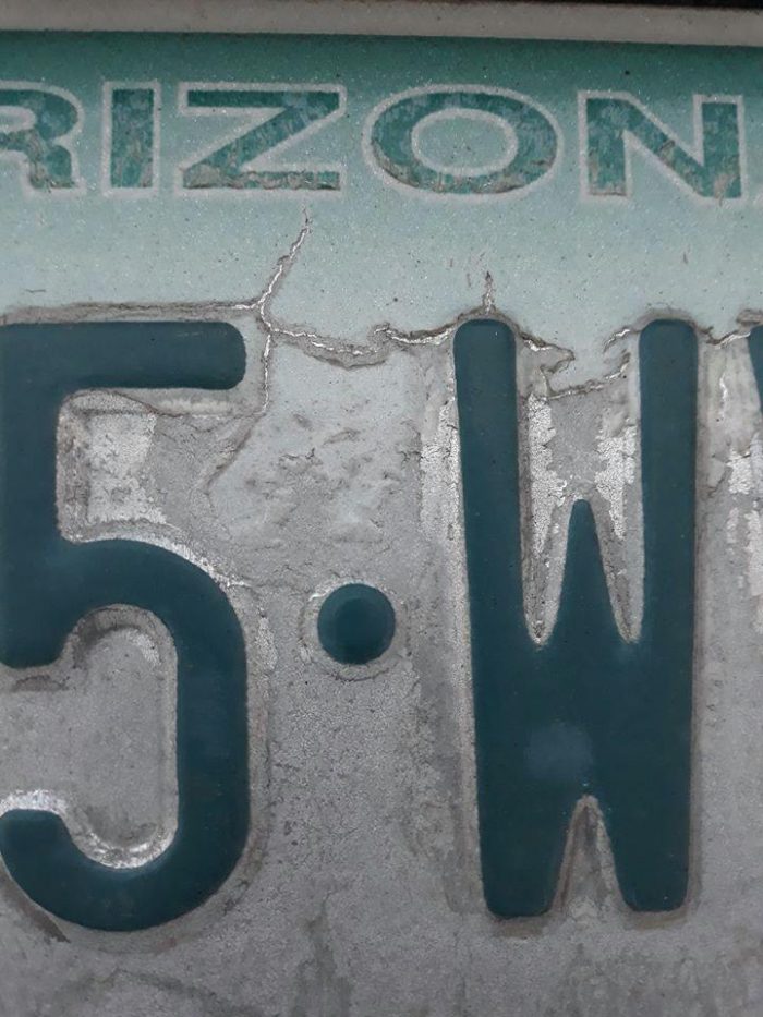 'What do you see in this picture? I noticed this on my daughter's license plate.